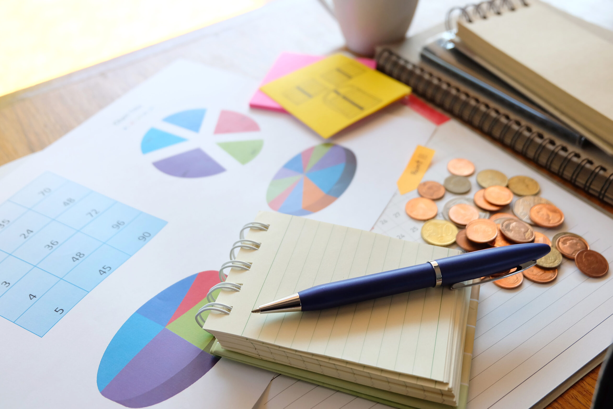 money and chart on wooden background with business concept